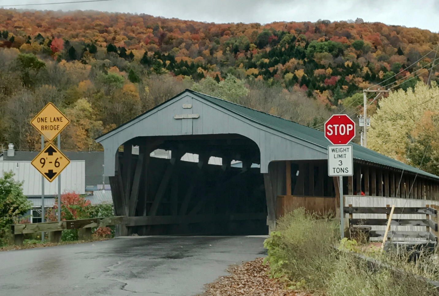 A stop sign on the side of a dirt road

Description automatically generated
